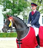 Lord Fantastic unter seinem langjährigen Reiter Christian Flamm - Foto: Schroeder
